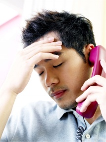 housing market crash Man on phone stressing because his real estate investing strategies are not working
